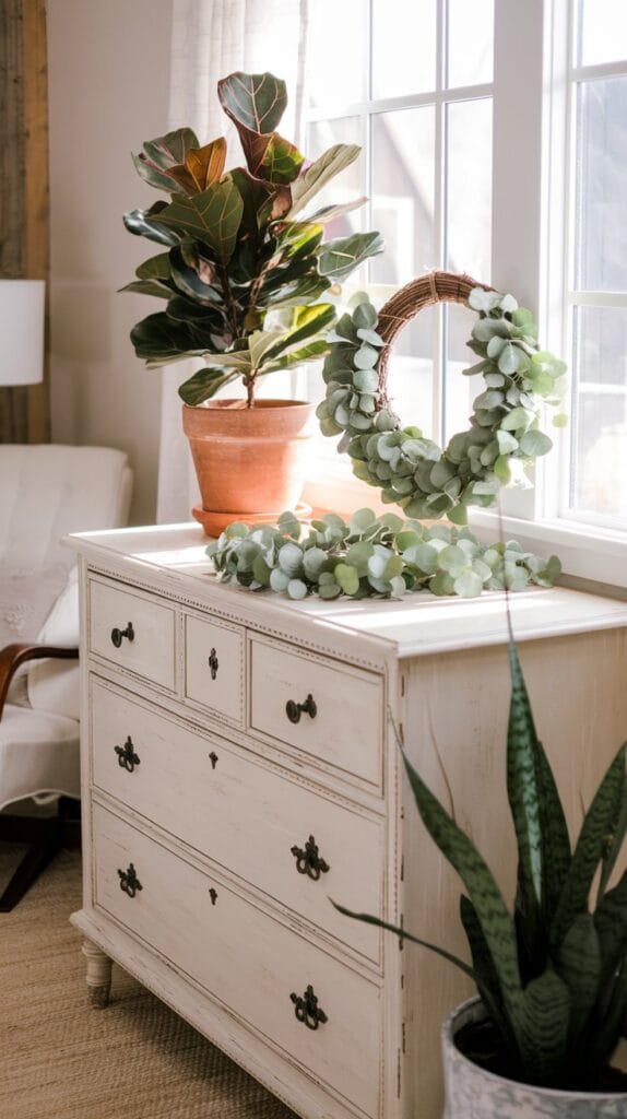 Potted plants and greenery in a farmhouse bedroom.