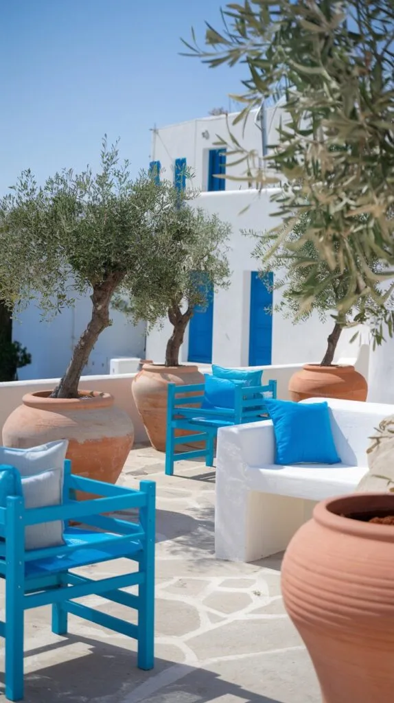  Mediterranean-inspired terrace with olive trees and vibrant blue accents.